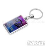 silver plated metal key ring key chain featuring the cancer logo in black