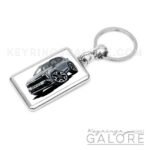 2025 kia sportage in grey encased in a metal keyring