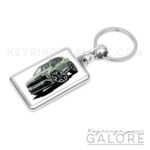 2025 kia sportage in jungle green encased in a metal keyring