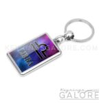 silver plated metal key ring key chain featuring the libra logo in black