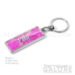 pink tourmaline birthstone silver plated metal keyring with personalized name in white font