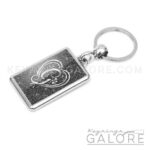 chrome plated key ring key chain personalized with monogram silver initial and black glitter background