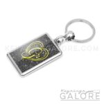 chrome plated key ring key chain personalized with monogram gold initial and black glitter background