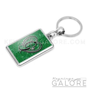 chrome plated key ring key chain personalized with monogram black initial and green glitter background