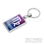 silver plated metal key ring key chain featuring the virgo logo in white